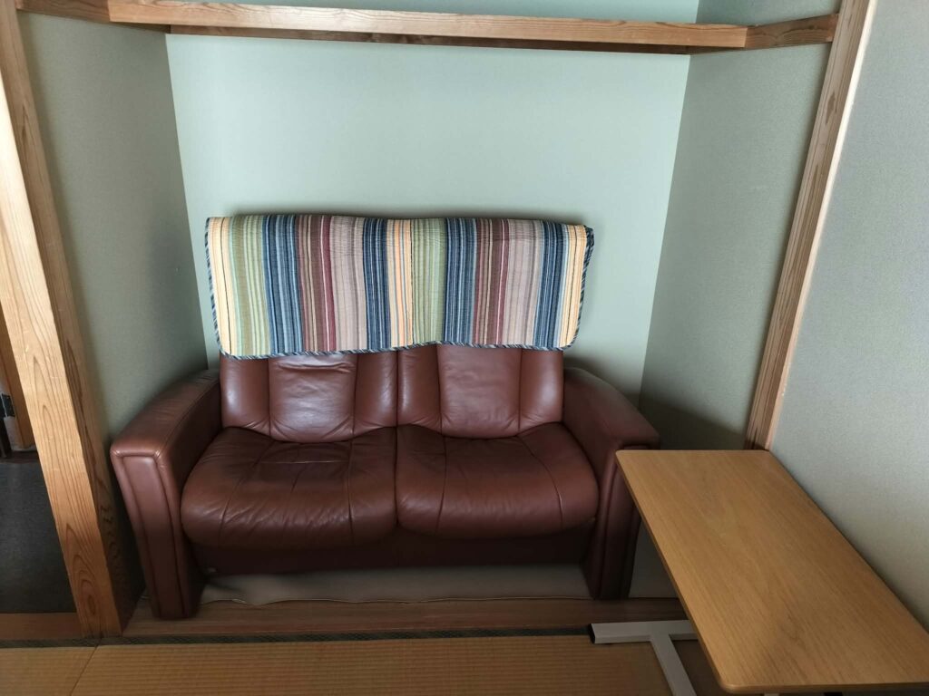 ROOMS Room 303: brown leather two-seater sofa